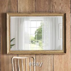 Miroir rectangulaire élégant effet chêne Fraser 104cm x 73cm suspendu au mur à manteau