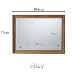 Miroir rectangulaire élégant effet chêne Fraser 104cm x 73cm suspendu au mur à manteau